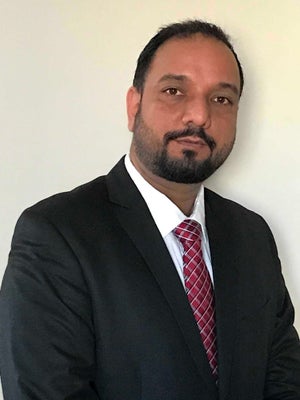 Portrait of Preet Braich, Associate.